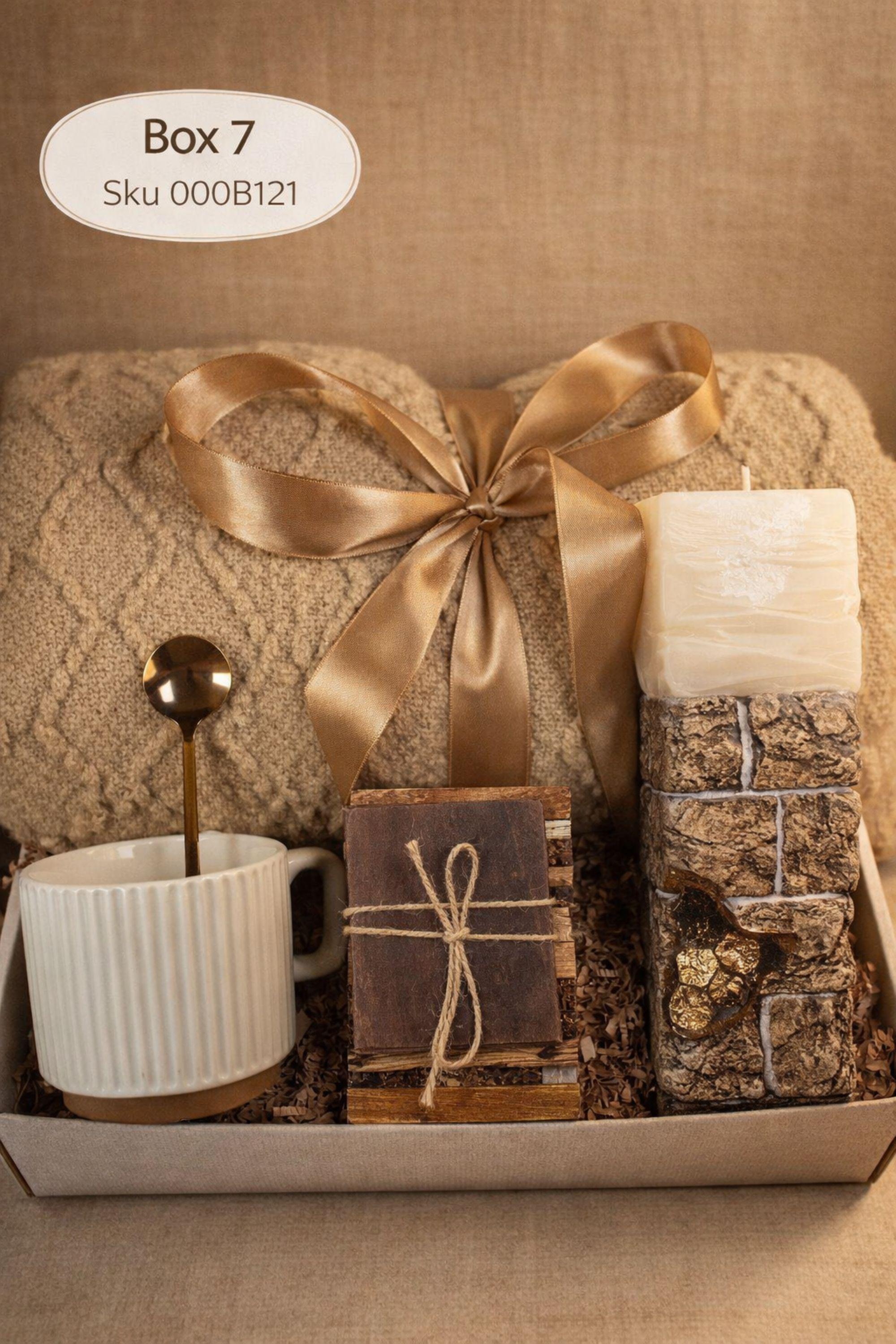 Sending You Hugs grief support gift box with sage knit blanket, ribbed green ceramic mug, handmade two-tone artisan soap, stainless steel spoon, and three bubble candles arranged inside kraft box on warm beige linen background. Sympathy care package designed for comfort during difficult times, loss support, thinking of you gift, and emotional encouragement.