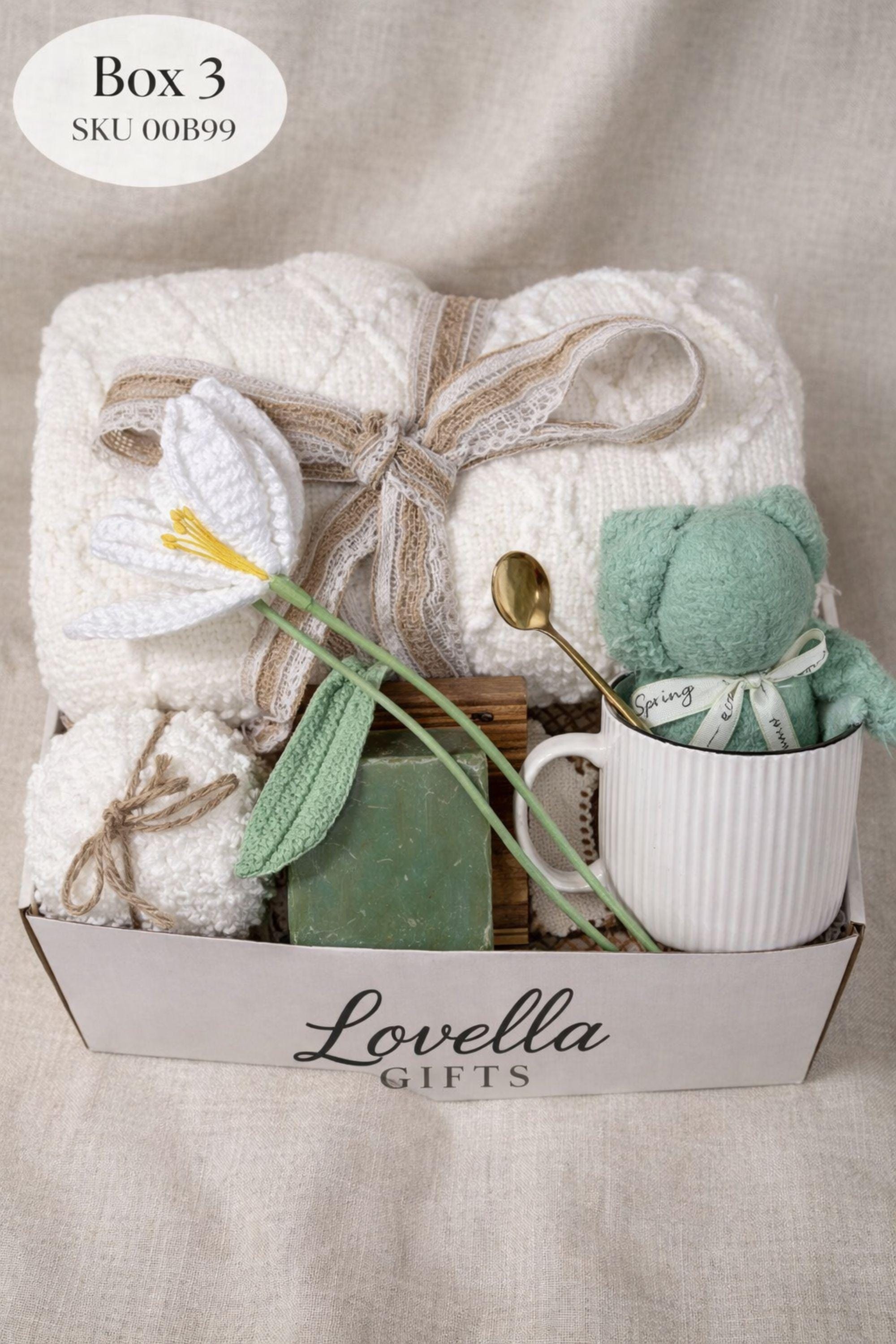 Get well soon gift box for her featuring cozy blanket, handmade soap, ceramic mug and spoon, comfort care package designed to help her feel better, thoughtful recovery gift for illness, cozy self care gift box for women, relaxing wellness gift, support gift for friend or coworker, thinking of you gift, ready to gift comfort package for rest, warmth and emotional care