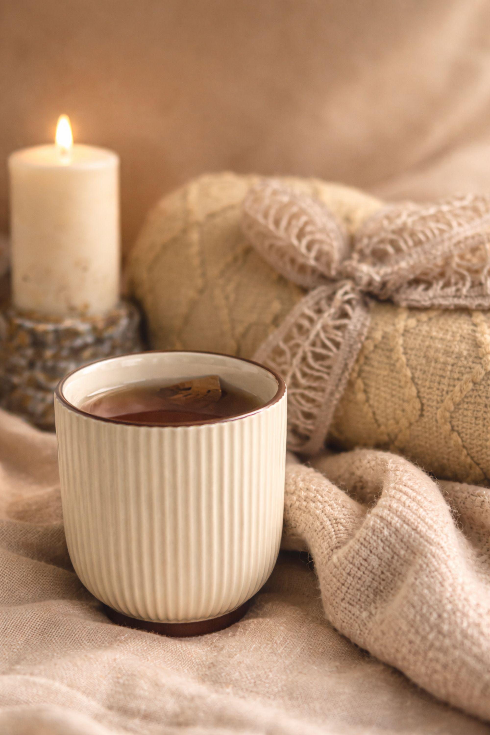 Thinking of You care package gift box featuring cozy knit blanket, handmade pillar candle on textured base, artisan soap with wooden holder, ribbed ceramic mug with spoon, beautifully arranged in a large white gift box. Comfort gift for women, sympathy support box, get well soon present, self care package, cozy curated gift ready to send.