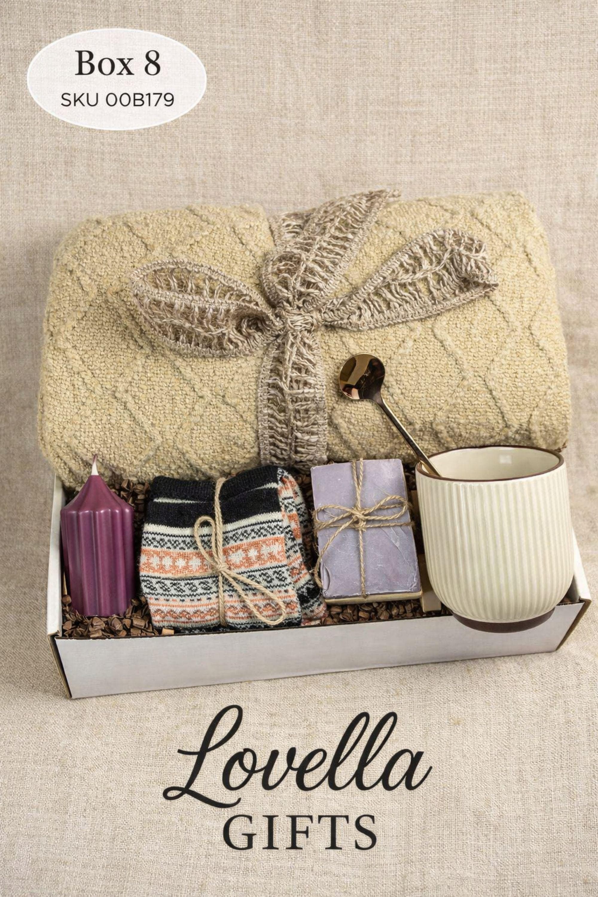 Breakup comfort gift box with cozy blanket, ceramic mug with gold spoon, plush teddy bear, handmade soap and face cloth arranged in gift box. Emotional support care package designed as a healing self care gift and thinking of you gift for friend going through breakup or difficult time.