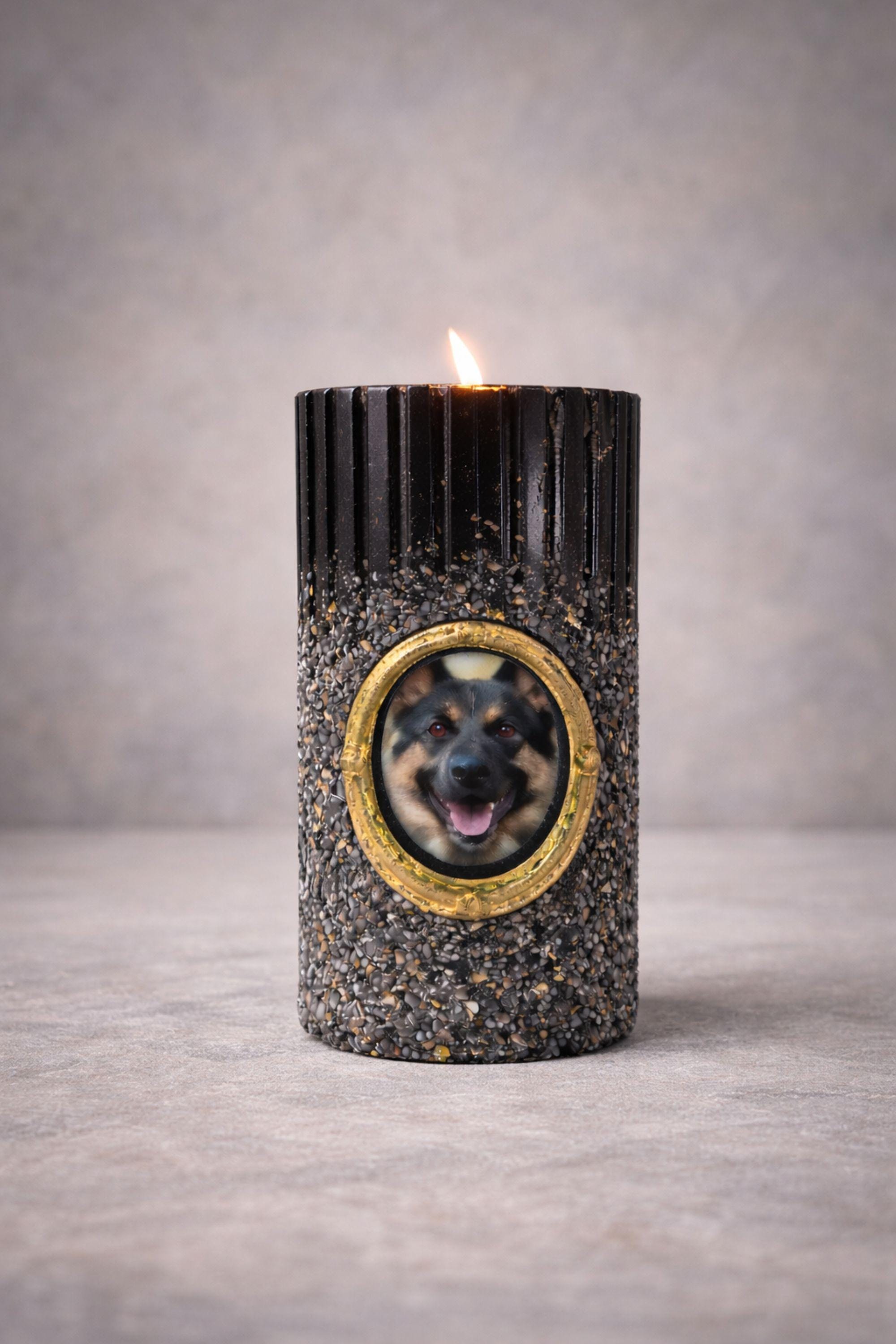 Personalized dog memorial candle with photo frame, pet loss sympathy gift featuring custom dog photo in gold oval frame, remembrance candle for loss of a dog, pet memory candle with textured black holder and lit candle flame, thoughtful pet memorial gift for grieving dog owners, dog remembrance keepsake, personalized pet loss candle, pet sympathy gift idea for loss of beloved dog companion.