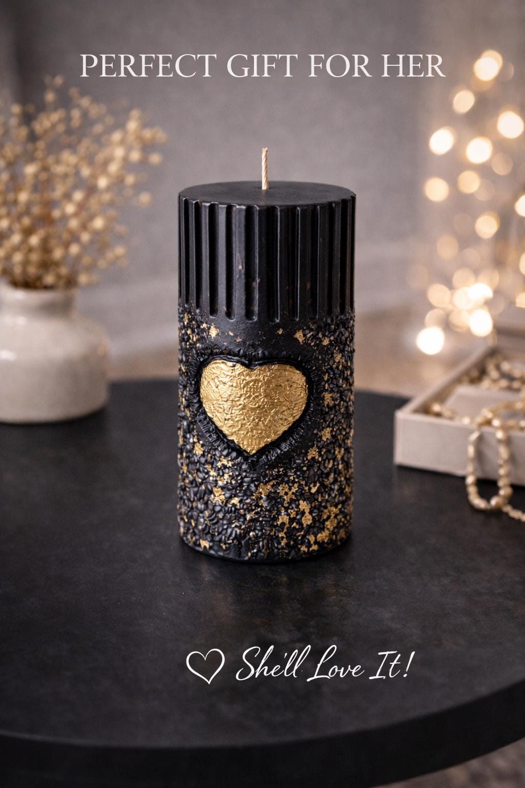 Black gold sculptural candle on table with warm lights, luxury decorative candle, romantic gift for her, modern home decor candle, aesthetic black and gold candle, unique gift idea