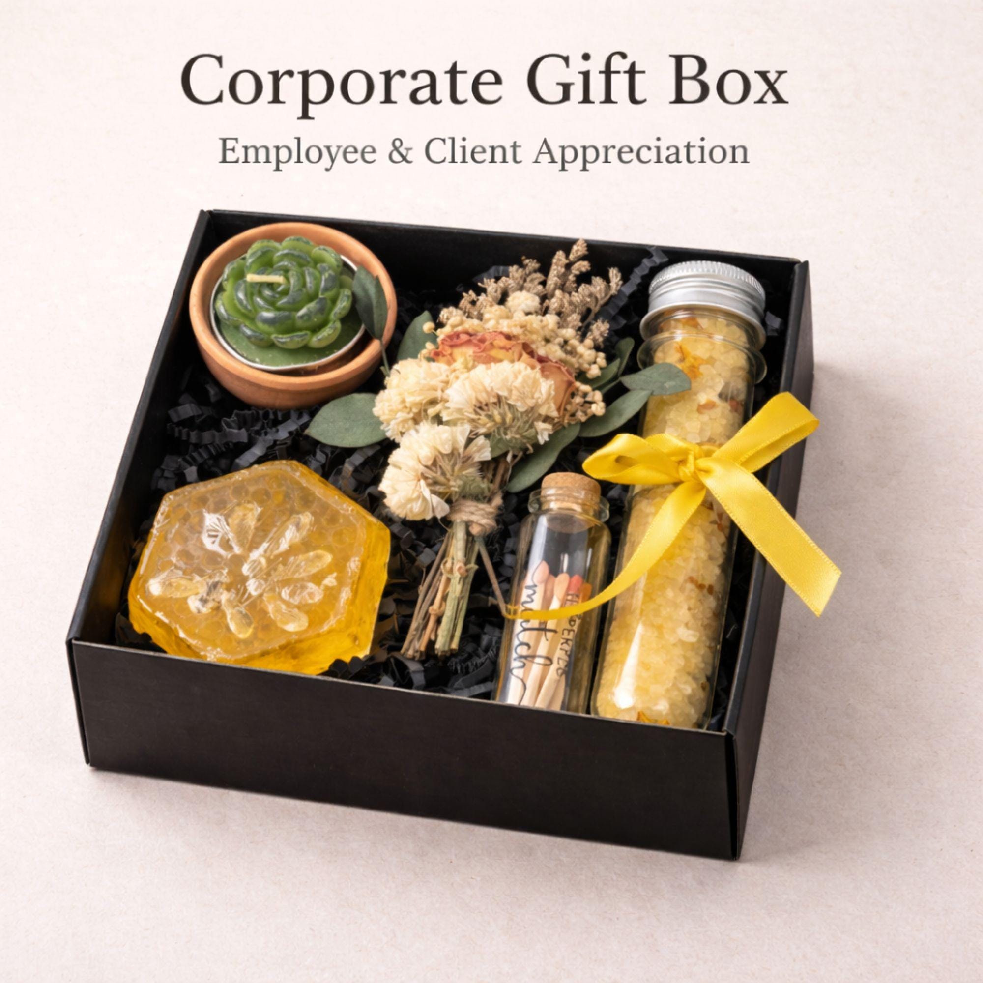 Corporate gift box for employee appreciation and client thank you gifting featuring handmade candle, bath salts, artisan soap, matches and dried flowers in elegant black box with yellow ribbon, compact 6x6 inch business gift set perfect for bulk corporate orders, office gifting, team appreciation, professional relationships and direct shipping to recipients