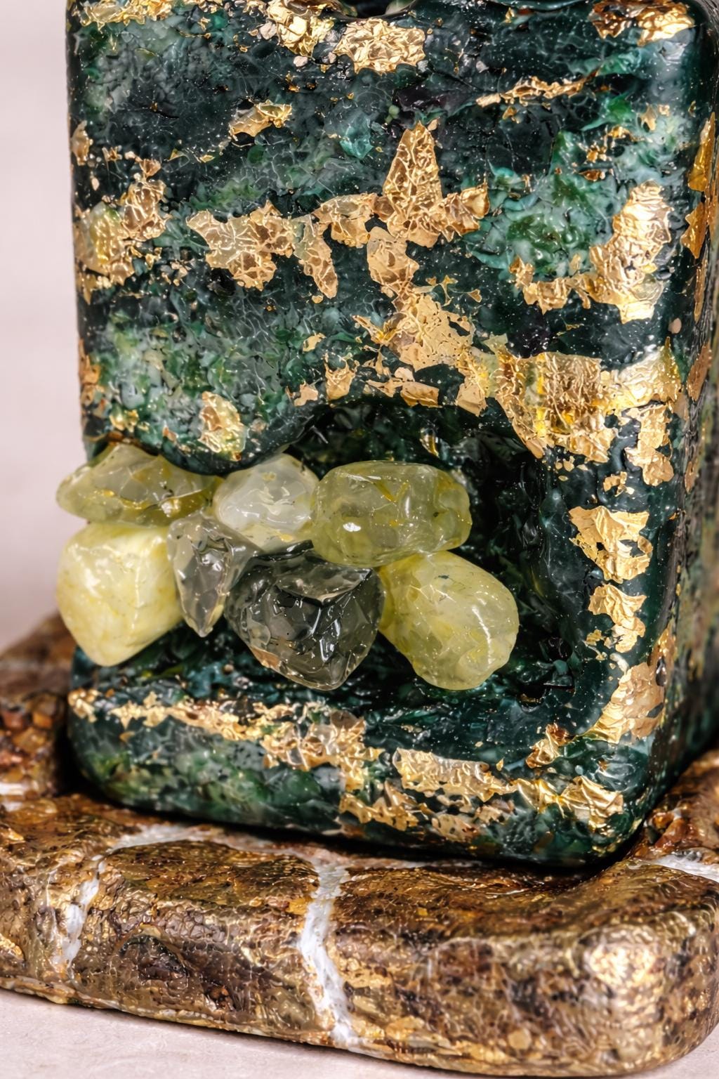 close up prehnite crystal candle gold leaf texture green handmade luxury candle detail
