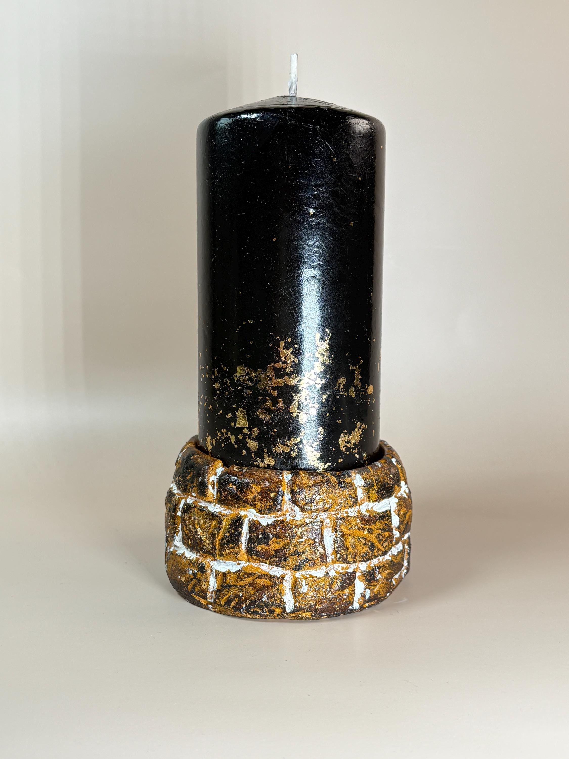 Sculptural black candle decor on textured stone base, minimalist home accent, modern aesthetic candle for coffee table styling, unique housewarming gift for her
