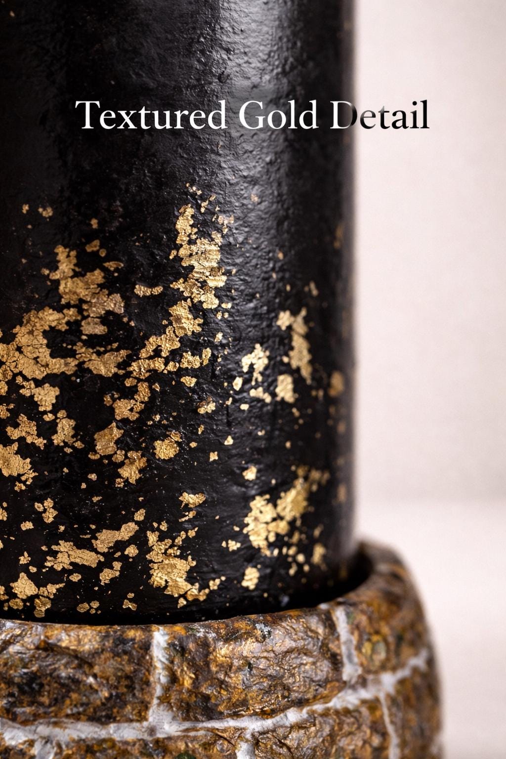 close up black candle gold leaf texture sculptural decorative detail