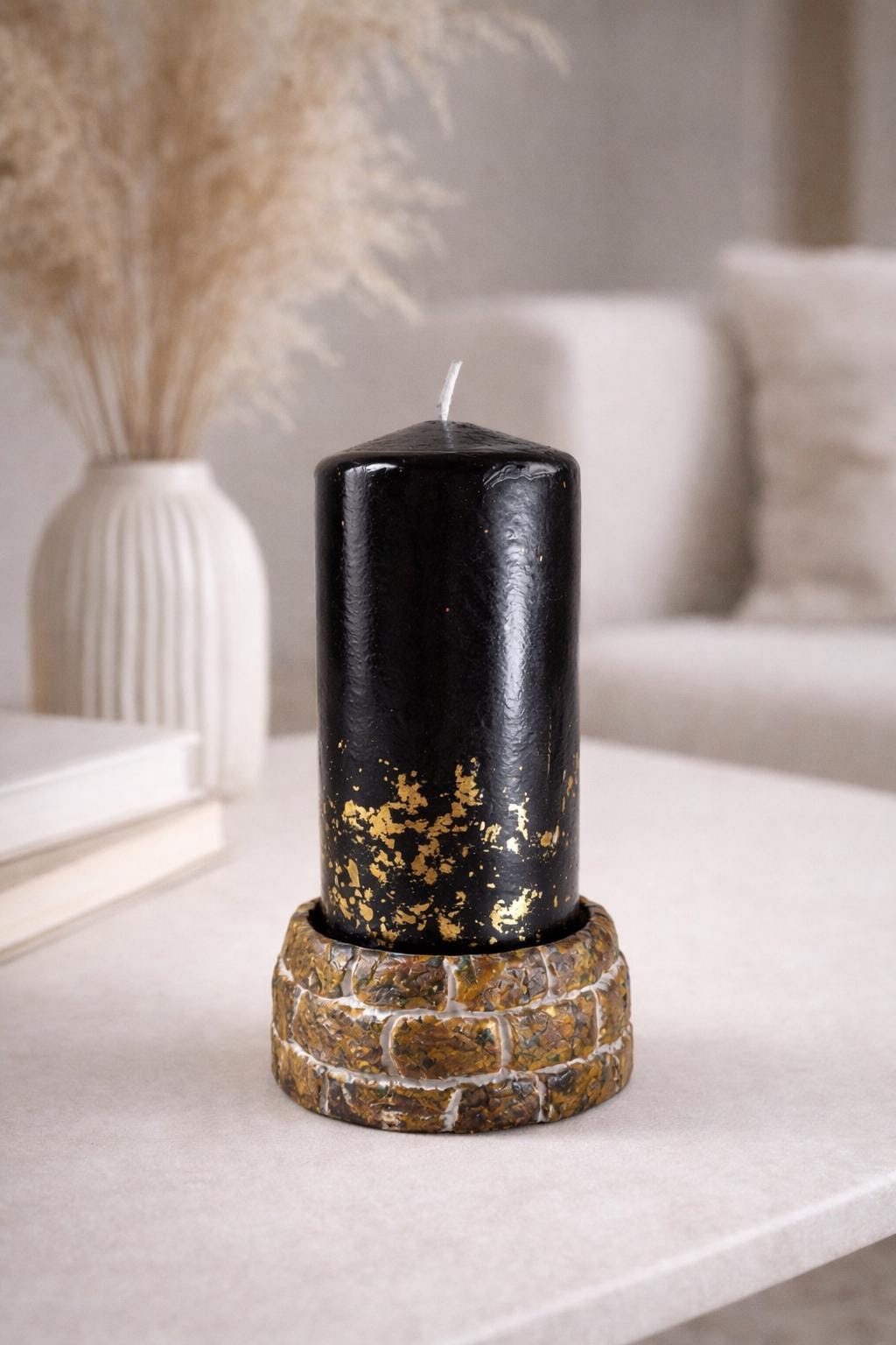black decorative candle in modern interior luxury home decor styling
