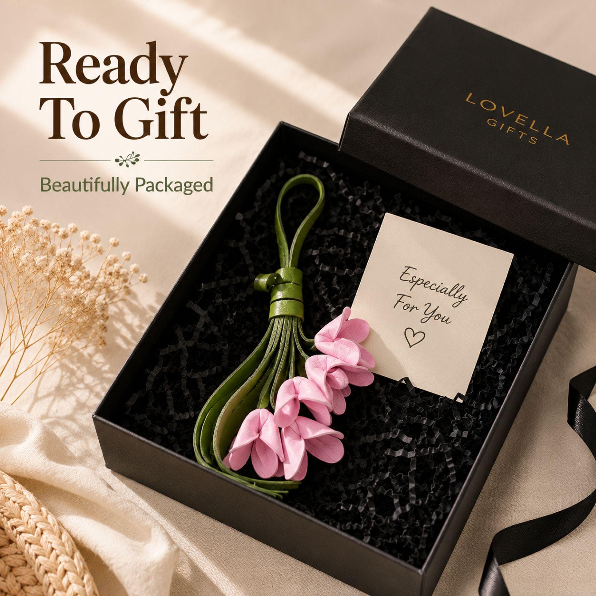 Handmade leather flower bag charm featuring five pink leather flowers, olive green leather tassel, and gold hardware attached to a woven straw tote bag. Floral purse charm designed for handbags, tote bags, beach bags, canvas bags, backpacks, and travel bags. Lightweight bag accessory and floral keychain that adds a feminine boho touch to everyday style. Perfect flower purse charm, tote bag charm, handbag decoration, summer bag accessory, gift for women, mom, sister, daughter, friend, bridesmaid.