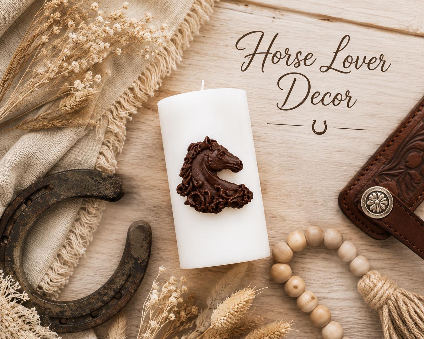 Decorative horse candle displayed in a rustic flat lay arrangement with a vintage horseshoe, dried flowers, linen fabric, wooden beads, and western-inspired accents. The white pillar candle features an intricate brown horse relief, creating elegant horse lover décor for farmhouse and equestrian interiors.