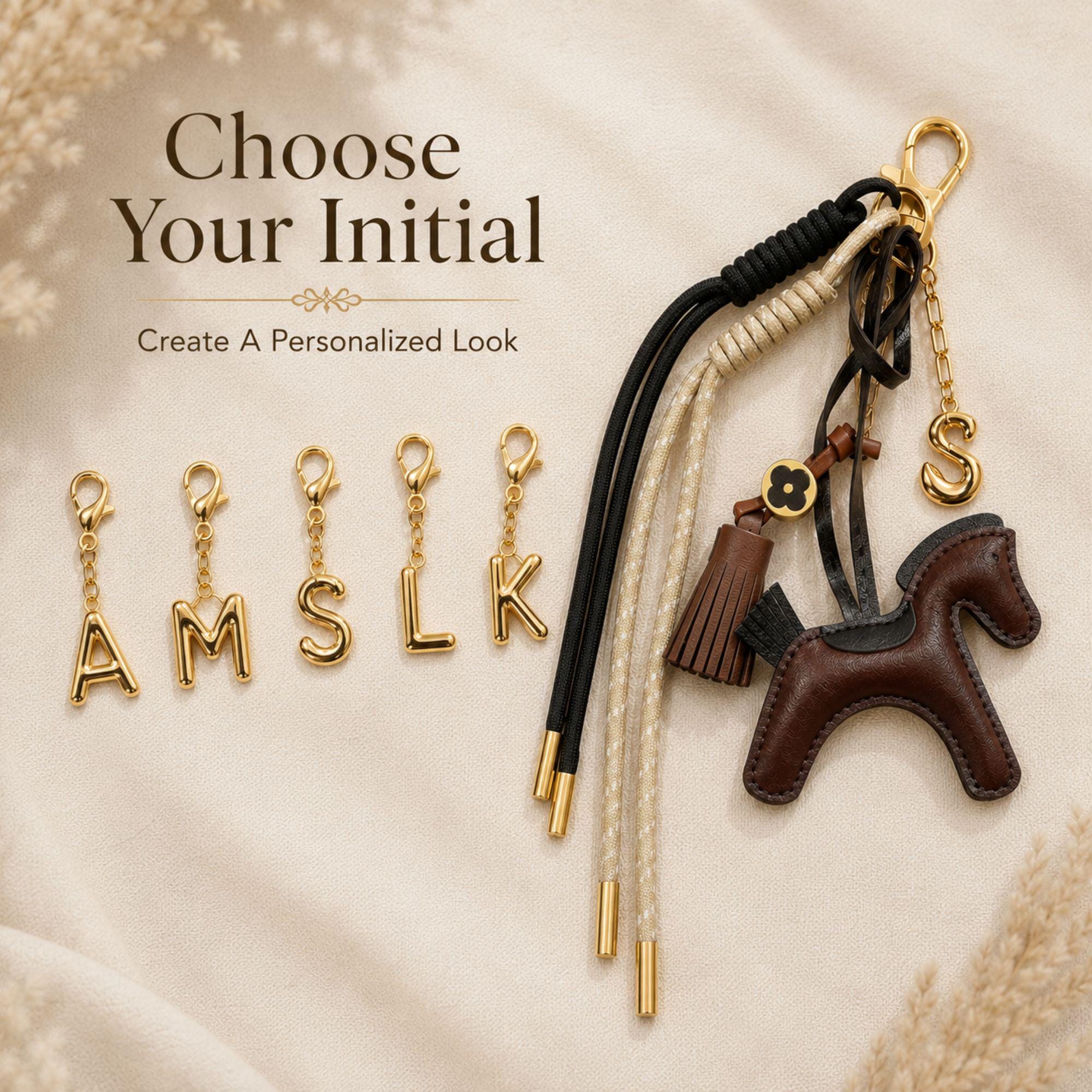 Handmade horse bag charm featuring a brown leather horse charm, tassel charm, decorative black and cream cords, and gold initial letter charm. Equestrian purse charm designed for handbags, tote bags, backpacks, travel bags, and everyday purses. Luxury horse keychain accessory for horse lovers, equestrian riders, western fashion enthusiasts, and women who love personalized handbag accessories. Stylish leather purse charm gift for her.