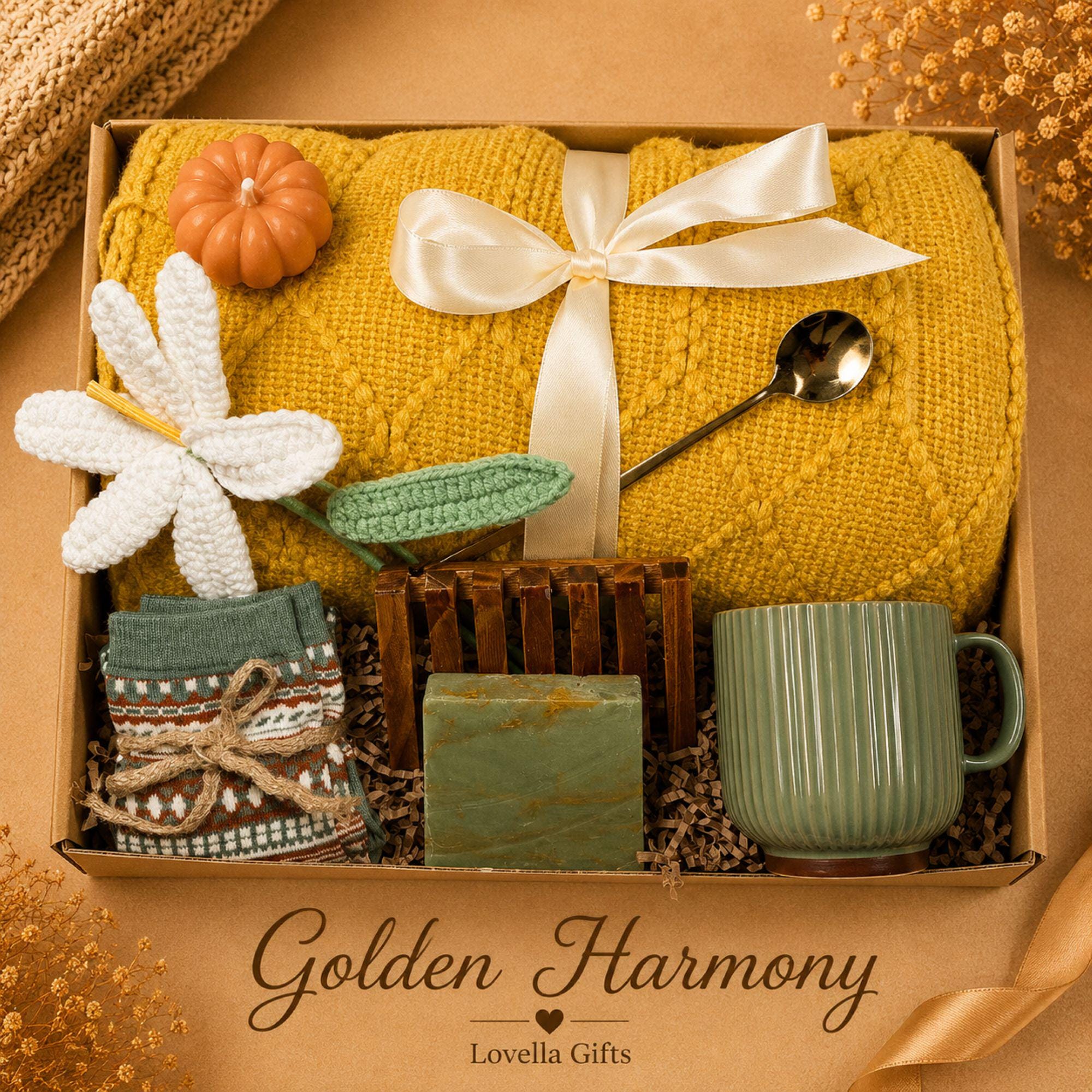 Thanksgiving gift box for women featuring a cozy knit blanket, handmade pumpkin soy candle, ceramic mug, artisan soap, decorative glass match bottle, plush teddy bear and cozy autumn socks in boutique gift packaging. Thanksgiving hostess gift basket perfect for hostess appreciation, thank you gifts, fall care packages, cozy blanket gifts, autumn self care, holiday gatherings, and seasonal gifts for mom, grandma, sister, friend, teacher or coworker.