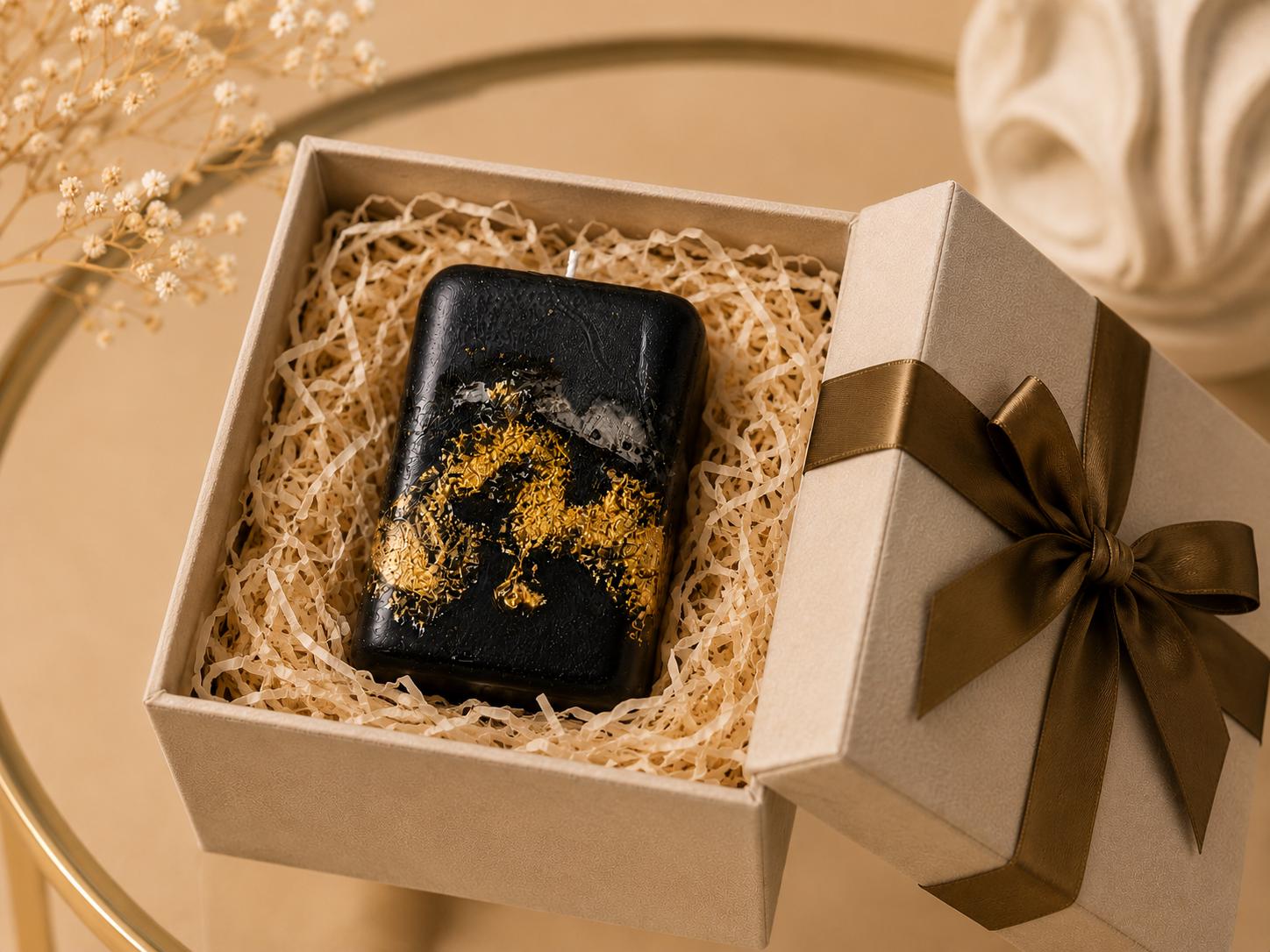 Black Gold Decorative Candle handmade luxury candle with gold leaf accents, sculptural black design, modern coffee table decor, and elegant housewarming gift styling.
