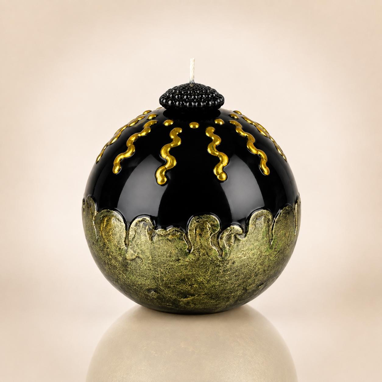 Luxury Decorative Sphere Candle black and gold handmade candle for modern home decor, sculptural art candle styling, and unique gift. Product image 1.