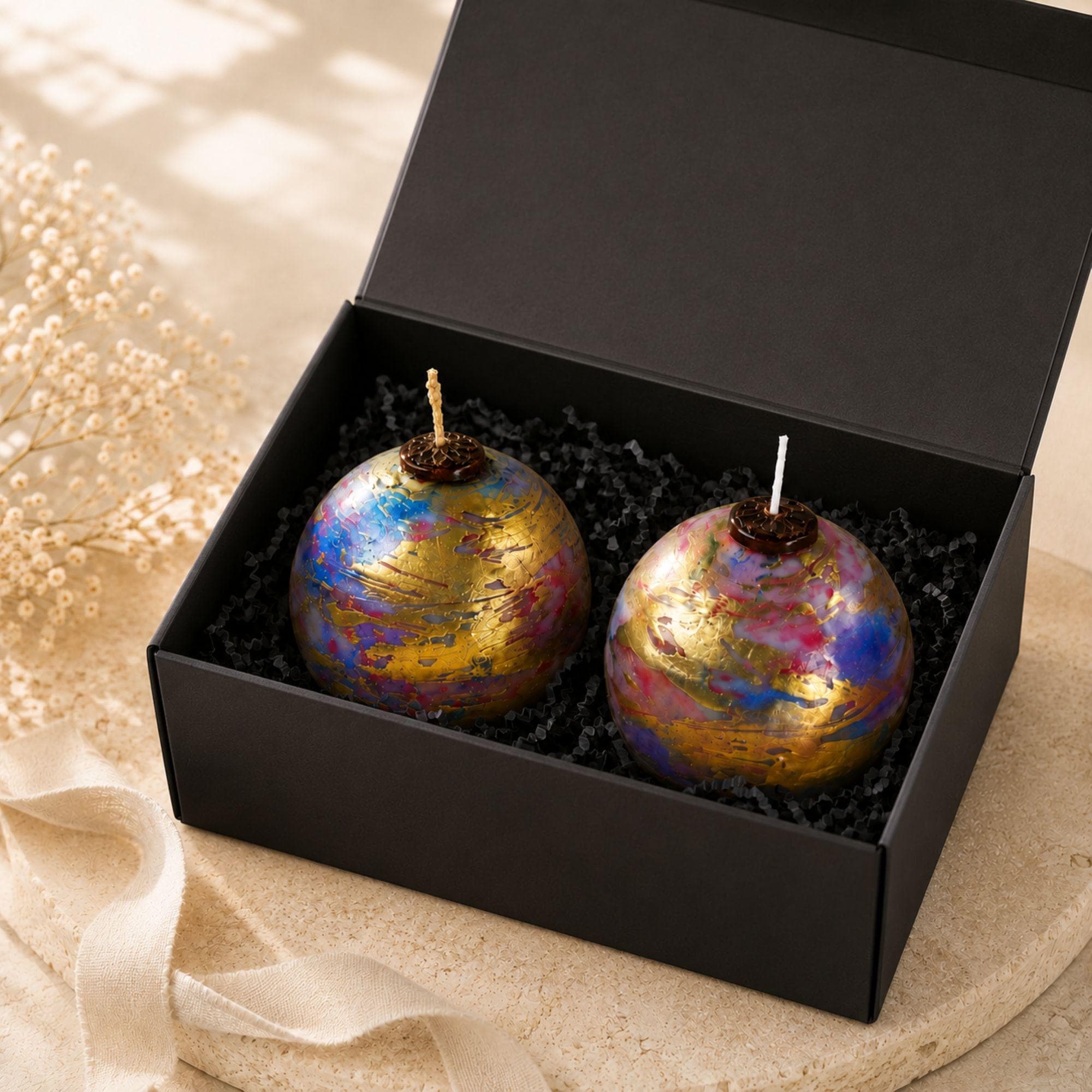 Handmade artistic decorative sphere candles featuring vibrant blue, pink, violet and metallic gold marbled finishes with unique handcrafted detailing. These colorful 3 inch unscented statement candles create striking artistic home decor, modern coffee table decor, mantel decor and unique home accents. Available as a single decorative candle or candle gift set, perfect for a housewarming gift, hostess gift, new home gift, gift for her or home decor lover.