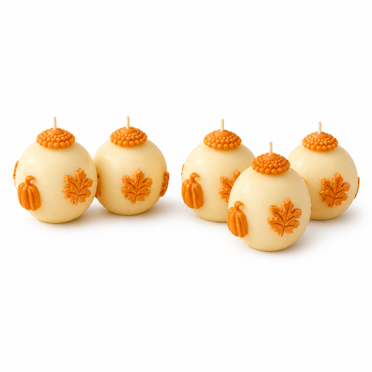 Pumpkin candle set for fall decor on clean white background